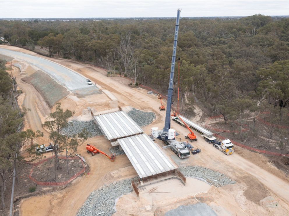 The last of the 125 super-tee beams about to be lifted into place