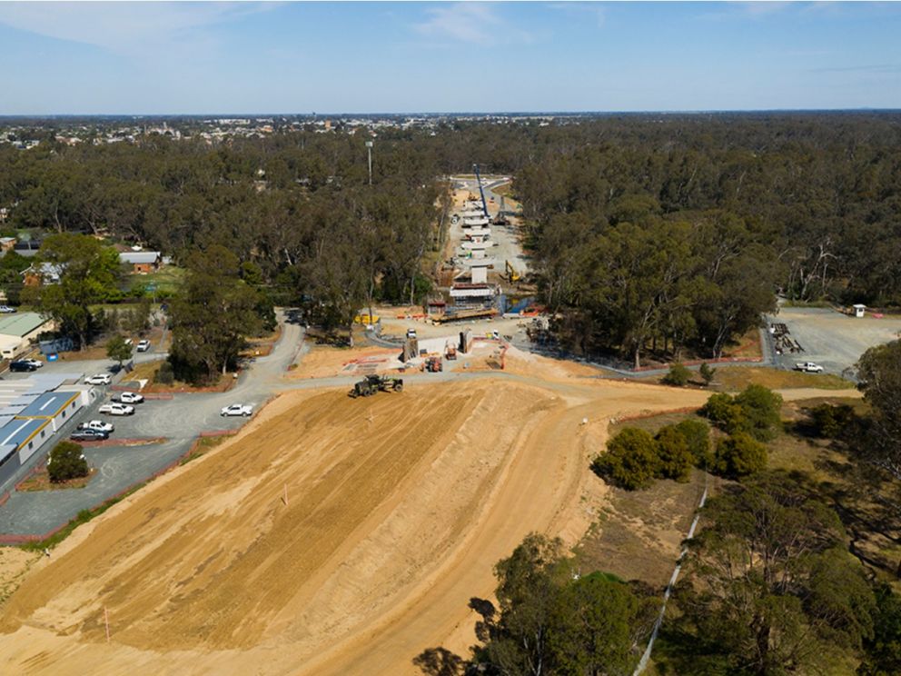 Image of Stage 3 of the Campaspe River bridge construction looking towards Warren St. The level ground is positioned at the forefront of the image with nature in the background