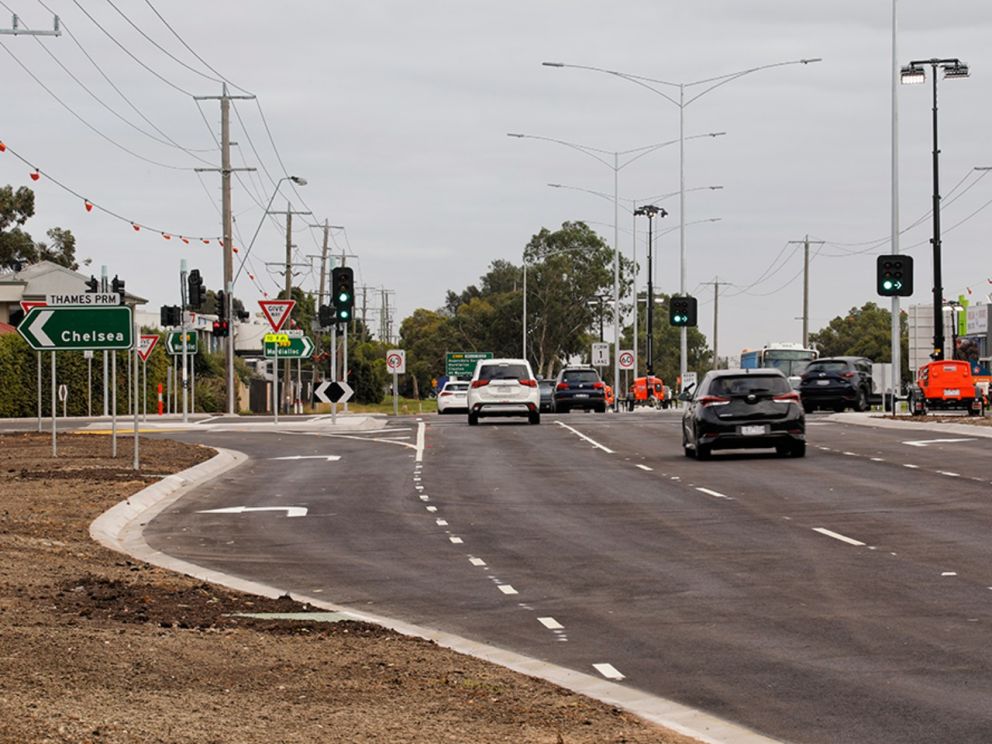 Traffic using the new lanes on Wells Road where it intersects with Thames Promenade. There are cars travelling along Wells Road