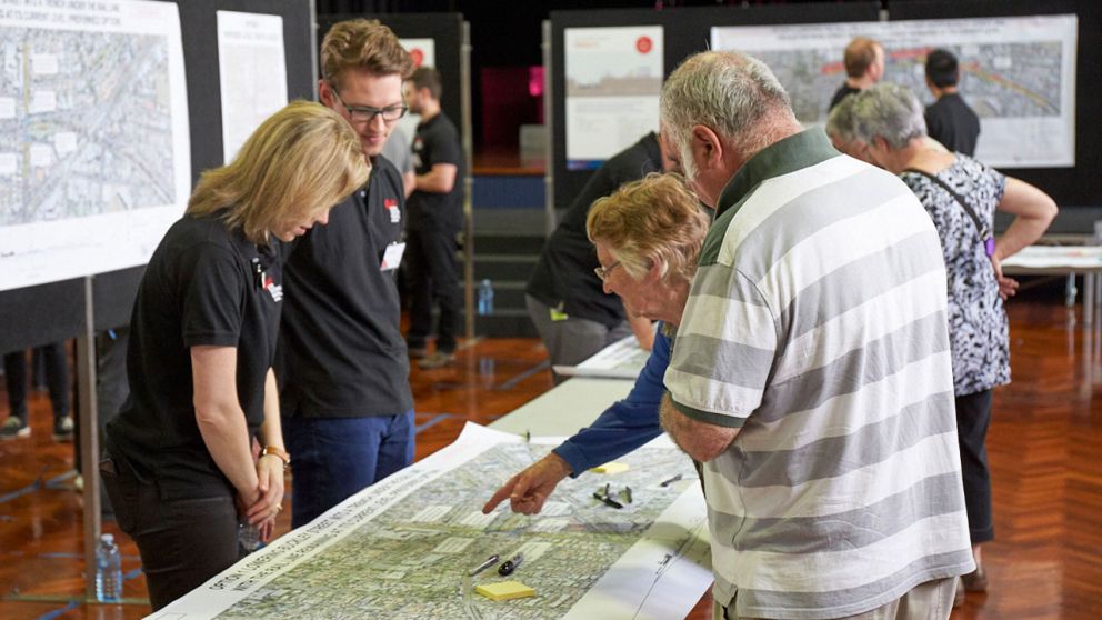 Community members at a level crossing removal information session