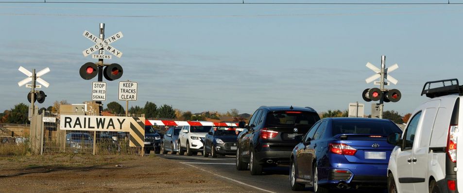 Traffic waiting at the Calder Park Drive level crossing in Calder Park