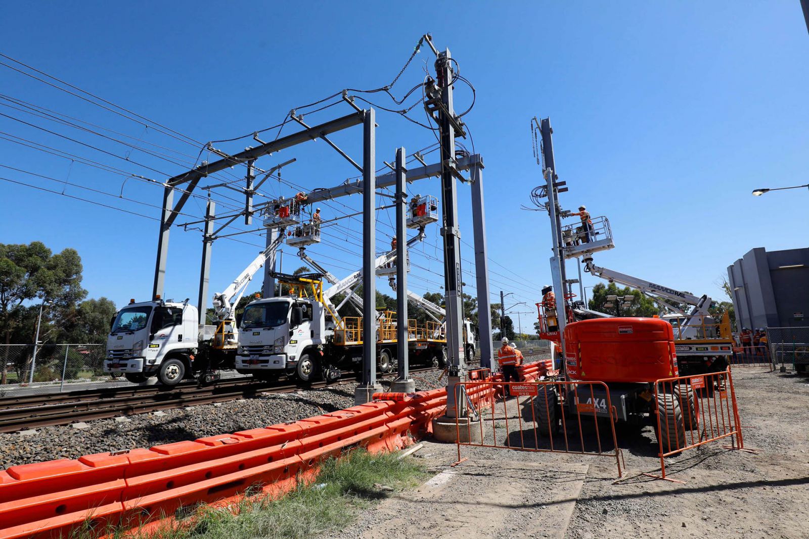 workers on vehicle cranes working