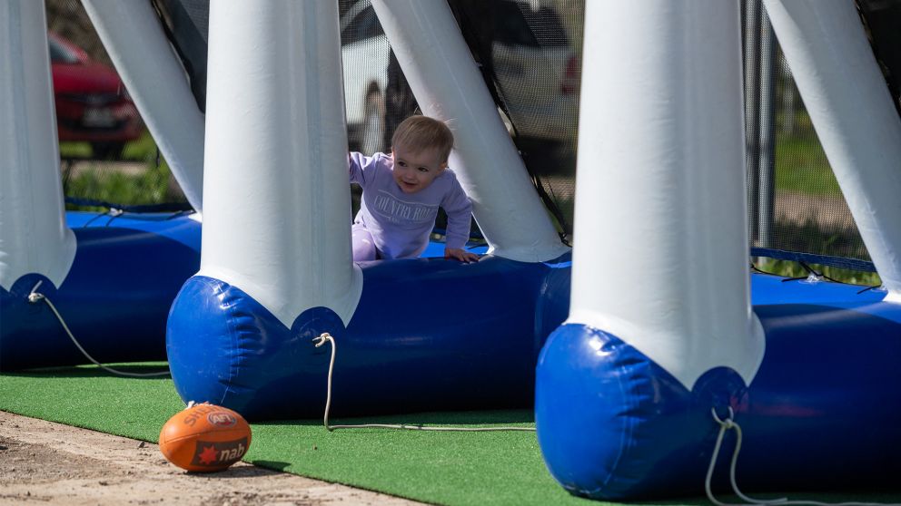 Shepparton community event baby chasing ball