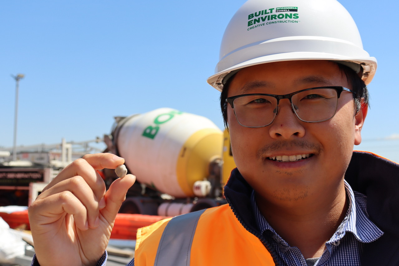 Construction worker holding a piece of PolyRok