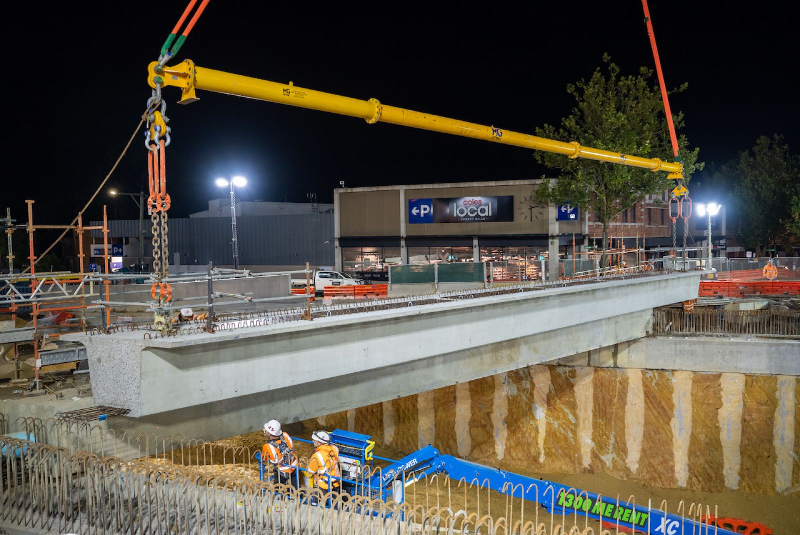 One of the road-bridge beams being installed over Union Road