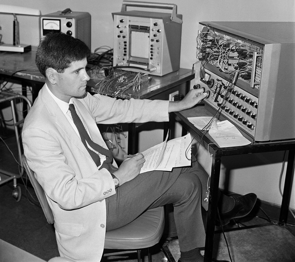 Dr Alec Gardiner of Monash University checks an analogue computer.