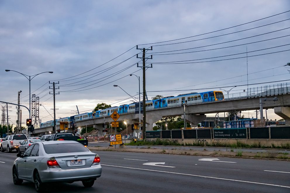 A train on the new city bound elevated rail bridge over Keon Parade