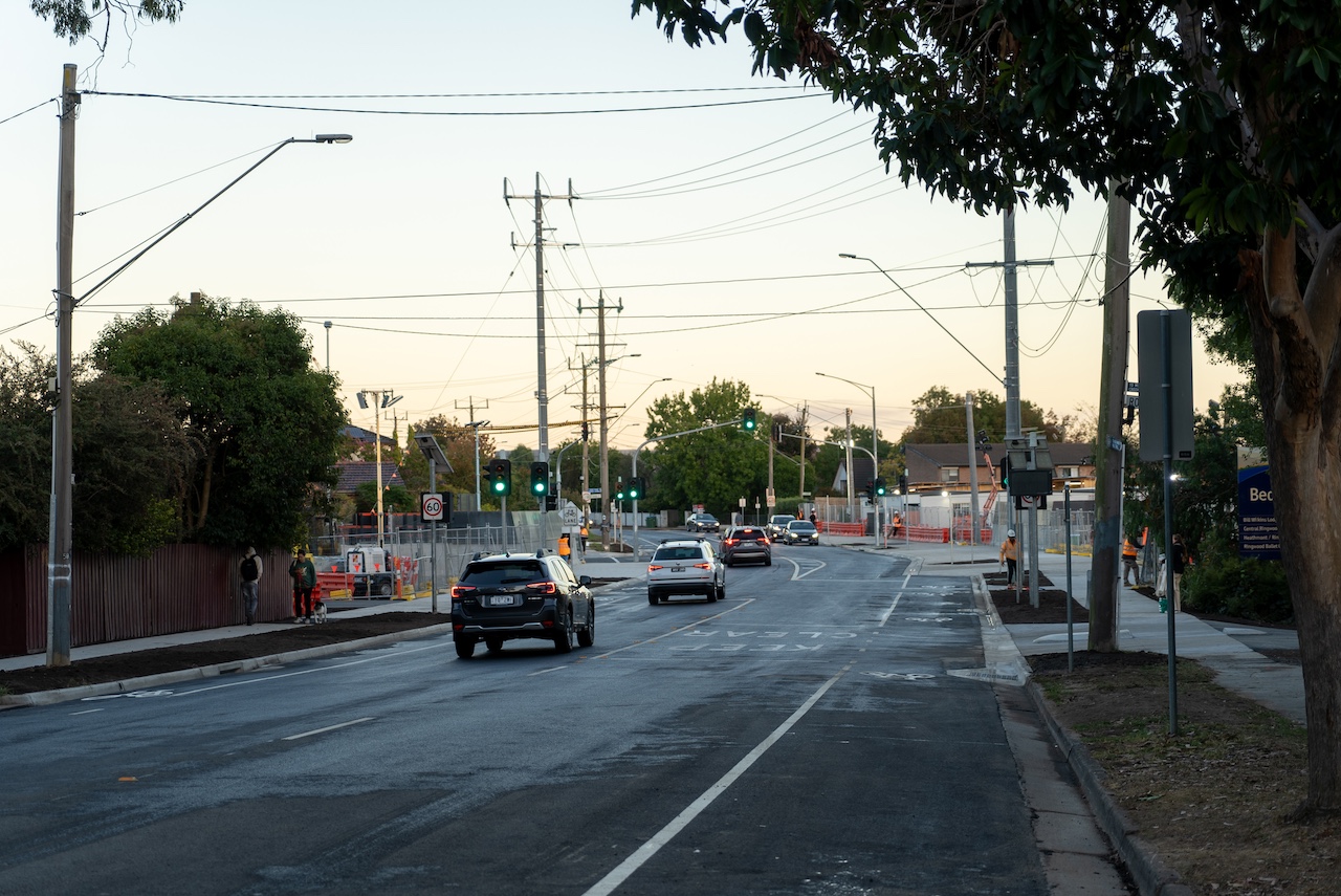 Cars on Bedford Road without boom gates or trains.