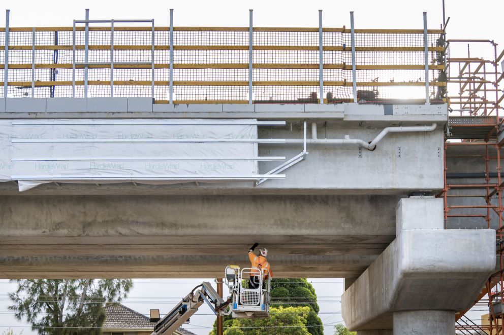 Crews working hard day and night to complete the rail bridge by spring