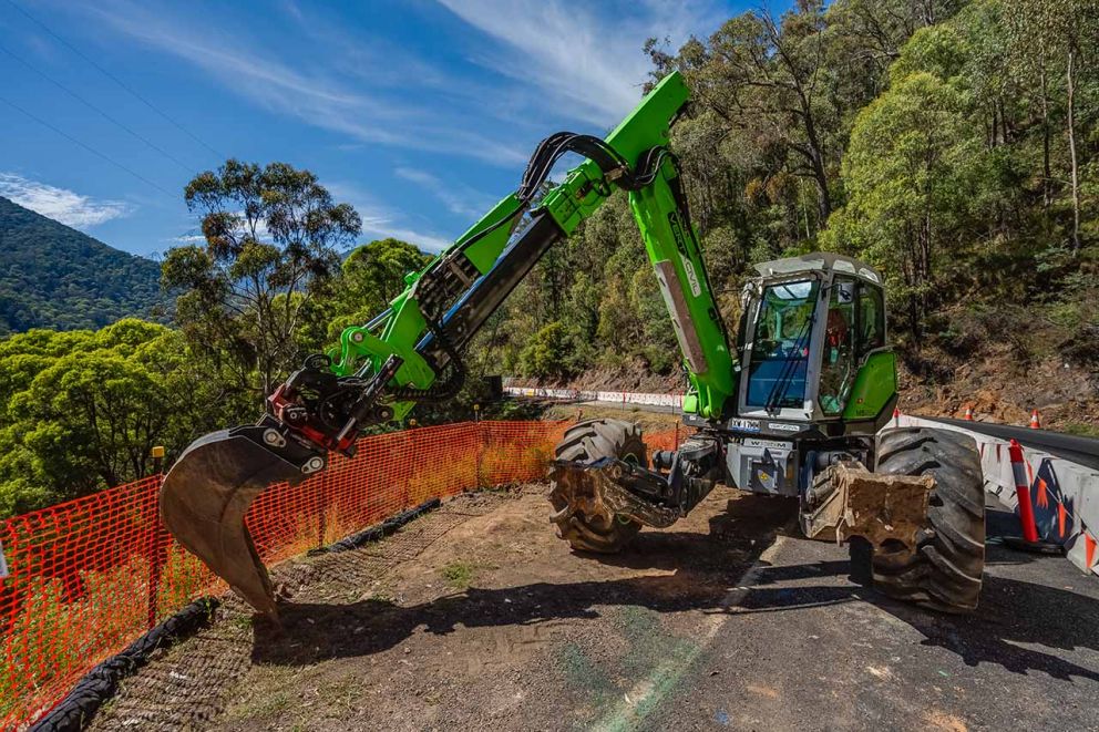 The spider excavator sits next to the road at the second smaller landslip