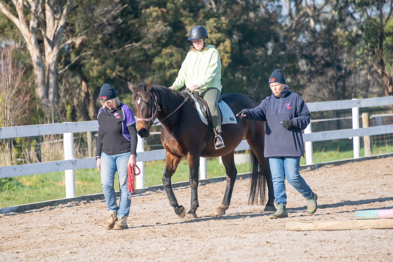 A woman rides a horse