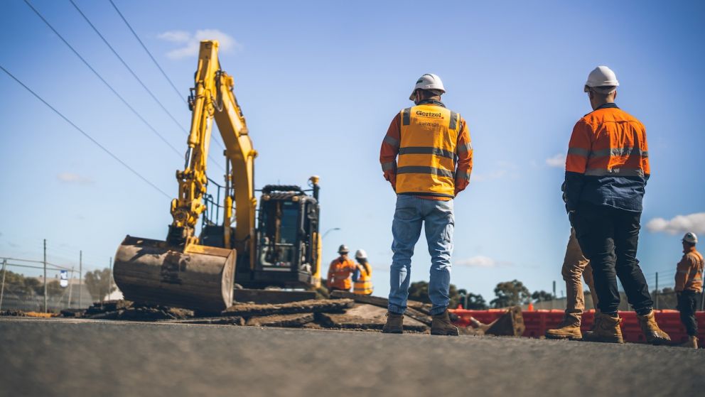 Construction workers watching roundabout works
