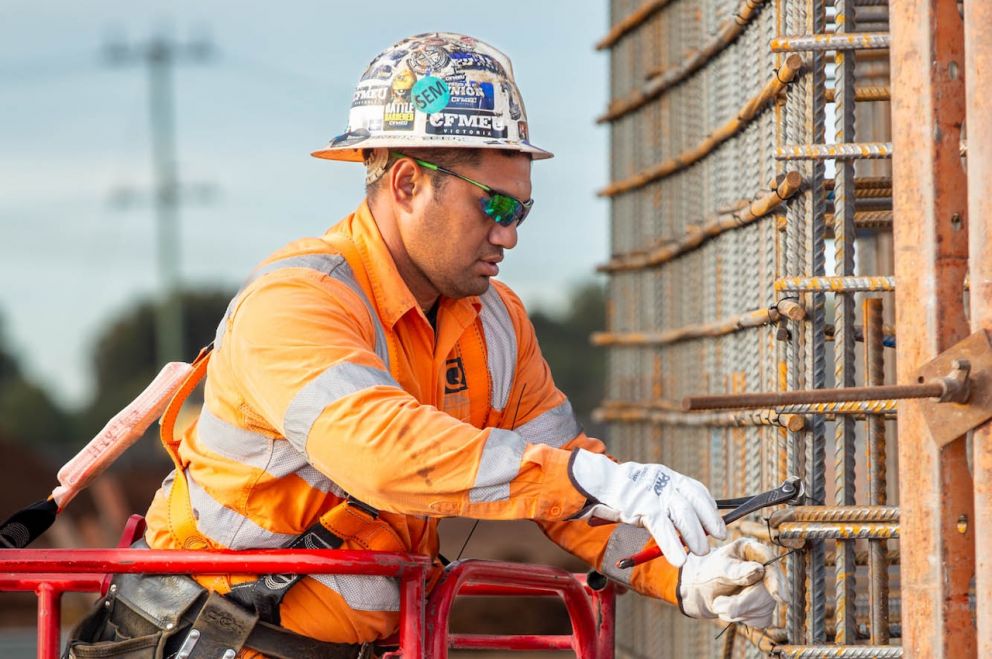 Tying together steel reinforcement