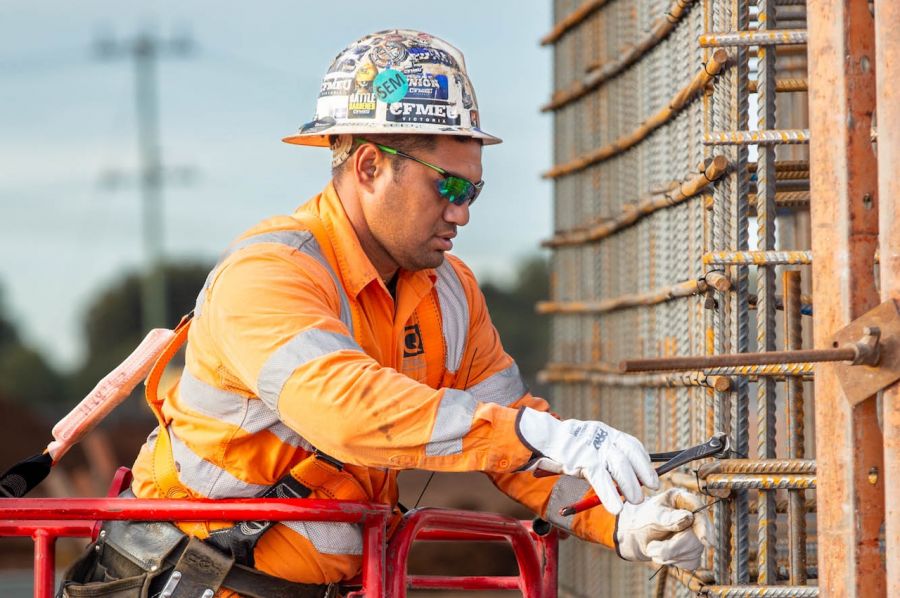 Tying together steel reinforcement