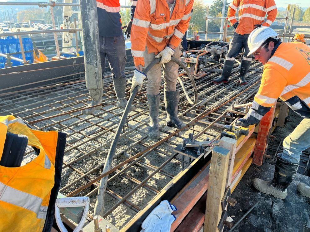 Pouring concrete to support the new pedestrian overpass and stairs