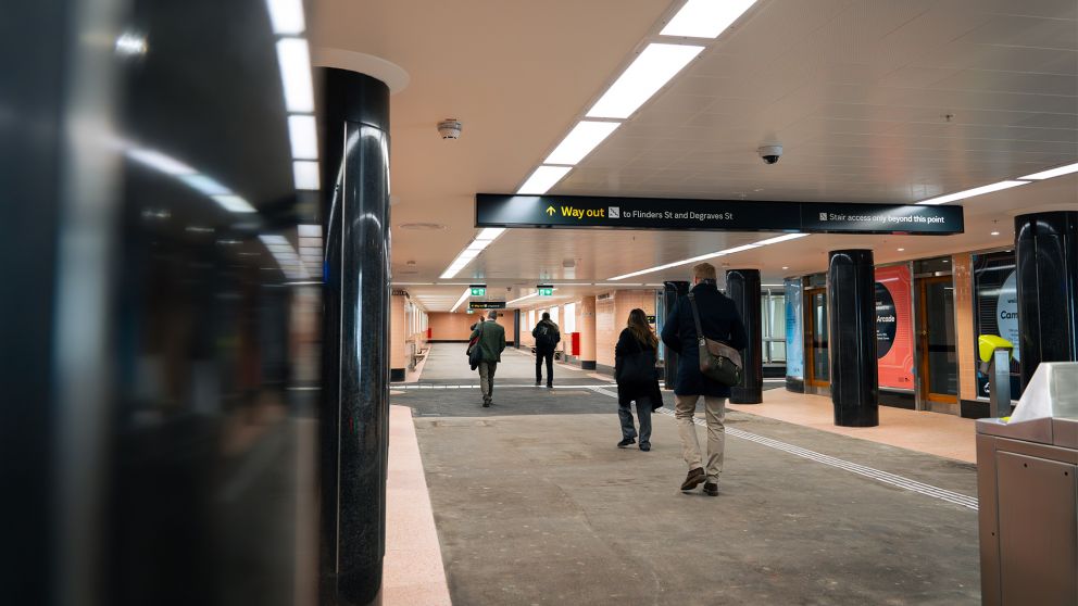 Passengers walk towards the Degraves Street exit through Campbell Arcade. 