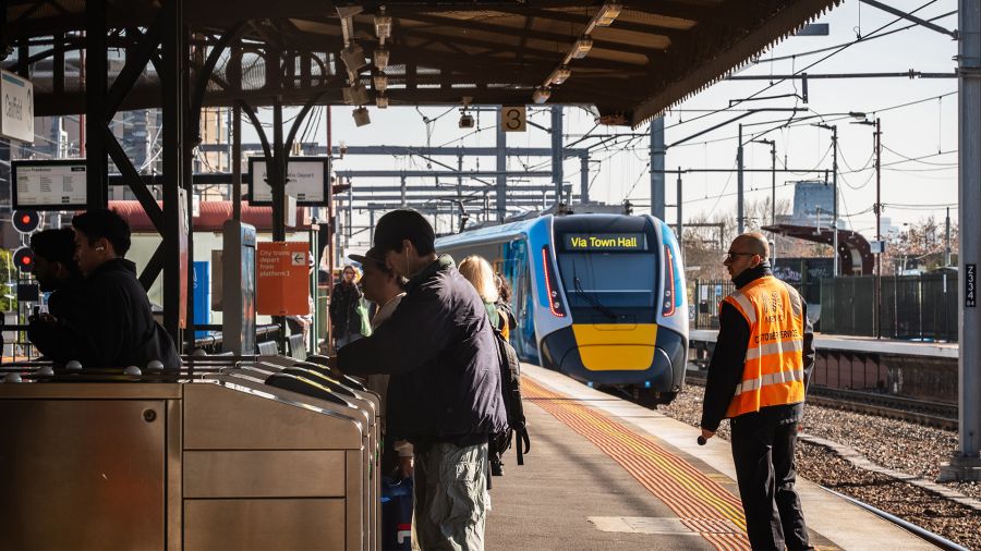 Passengers disembark at Caulfield Station platform 3
