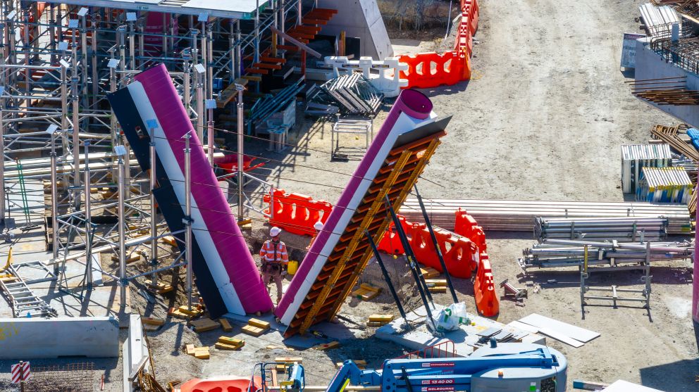 Piers for the pedestrian and cycling bridge over the rail line at Champion Road are taking shape
