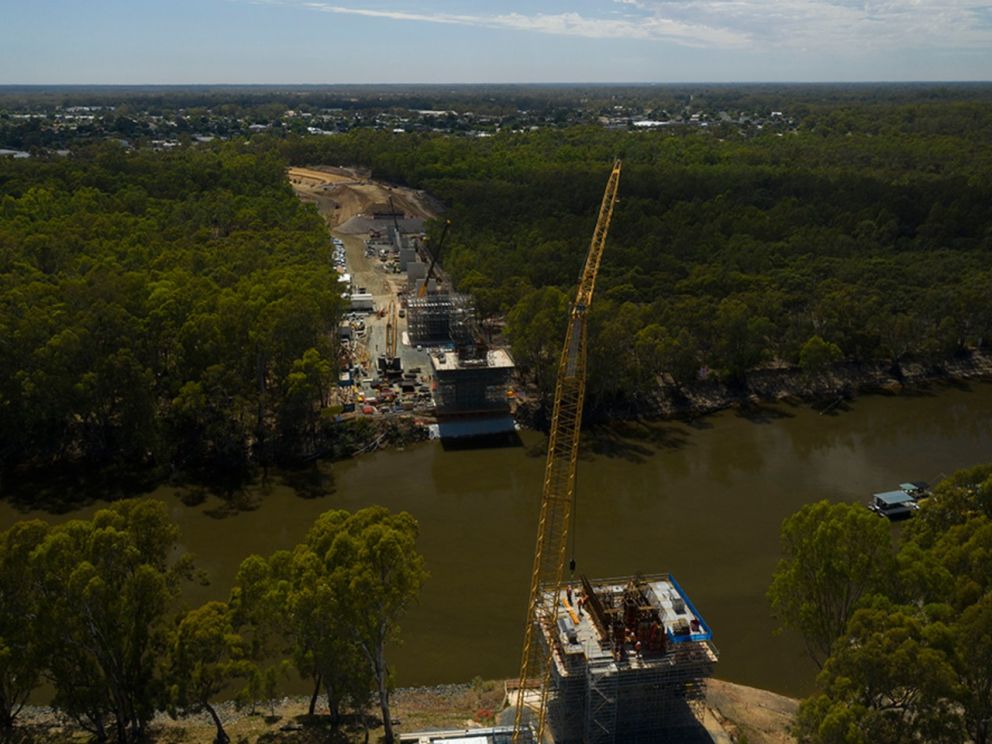 Mid-construction image of the Murray river bridge looking towards NSW with a crane
