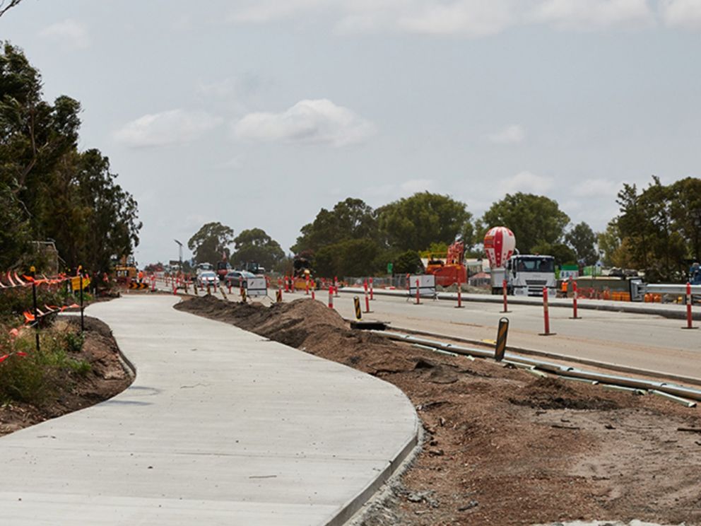 Image of completed walking/cycling path with surrounds still under construction