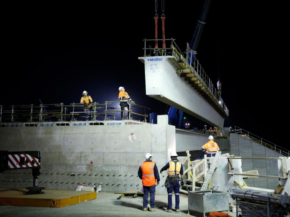 Lifting the beams into place for the bridge over Centre Dandenong Road.