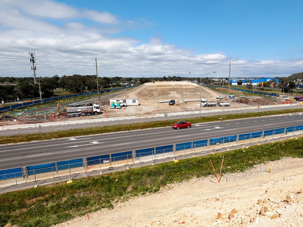 Continuing to build the earth embankments for the bridge over Springvale Road