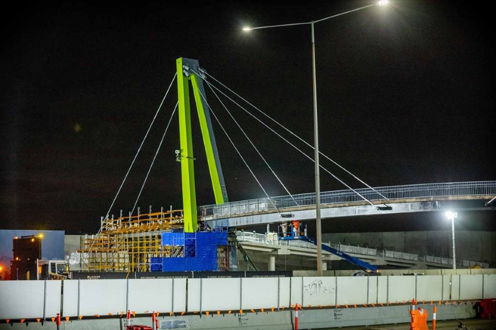 The Blaxland Avenue overpass being painted in the colour 'Kikuyu' which was chosen by the local community.