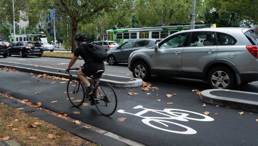 Traffic on St Kilda Rd with a cyclist on the  new cycling lanes