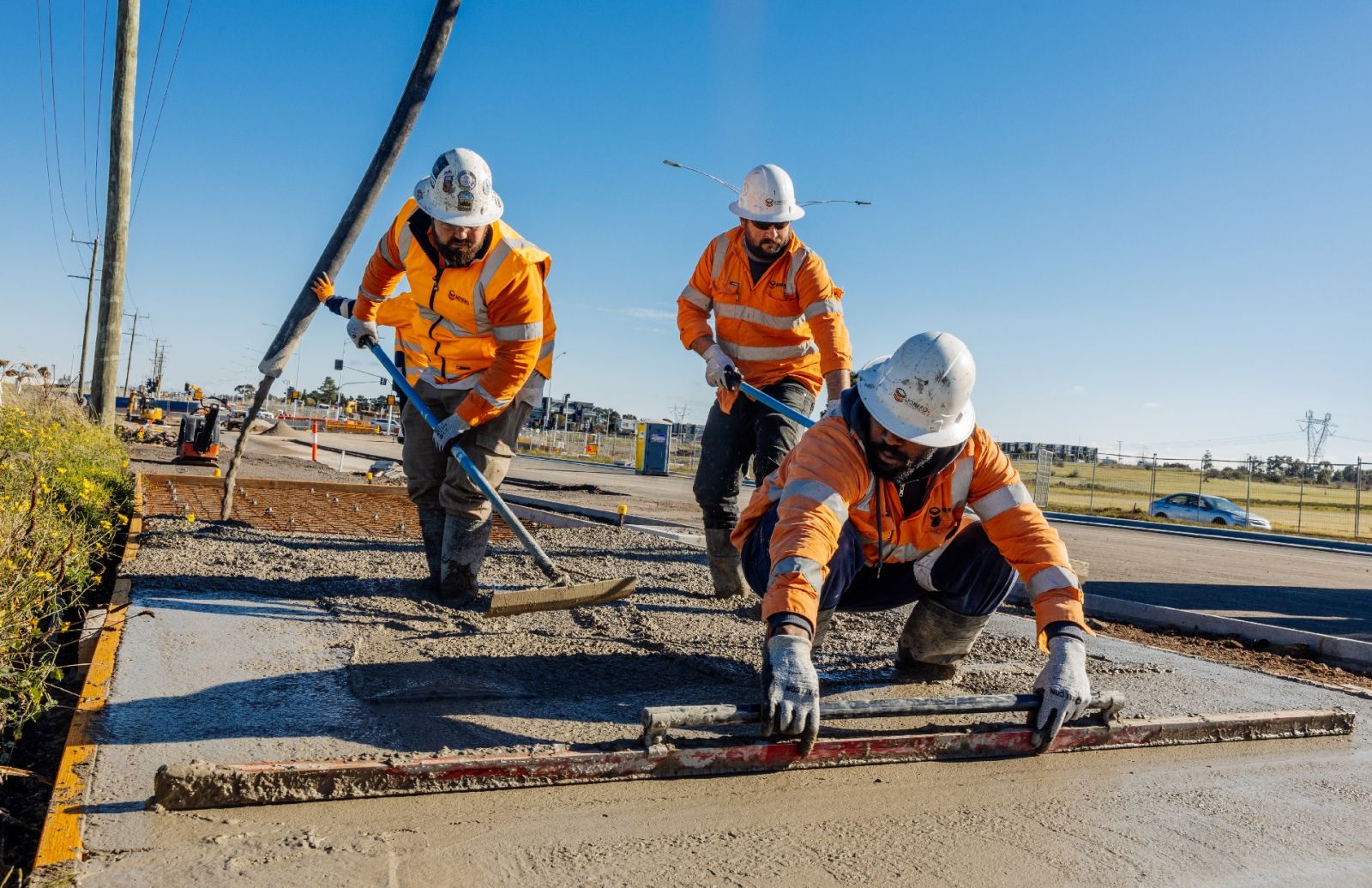 Aboriginal contruction workers from Monero constructions laying concrete road