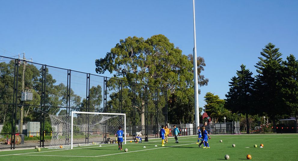 Members of FC Bulleen Lions training on the Veneto Club synthetic soccer pitch. 