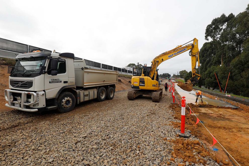 Laying the base of the retaining wall along Heatherton Road