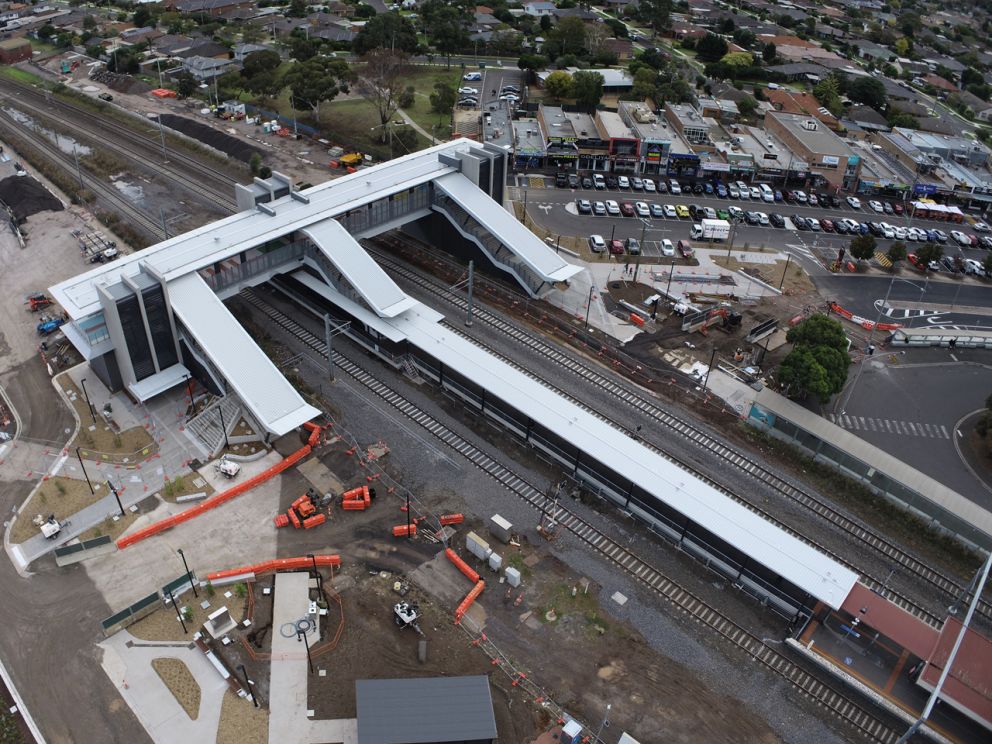 Aerial view of Hoppers Crossing Station with a white elevated building for pedestrians to use.