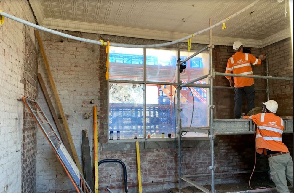 Workers on site conducting restoration works at North Williamstown Station