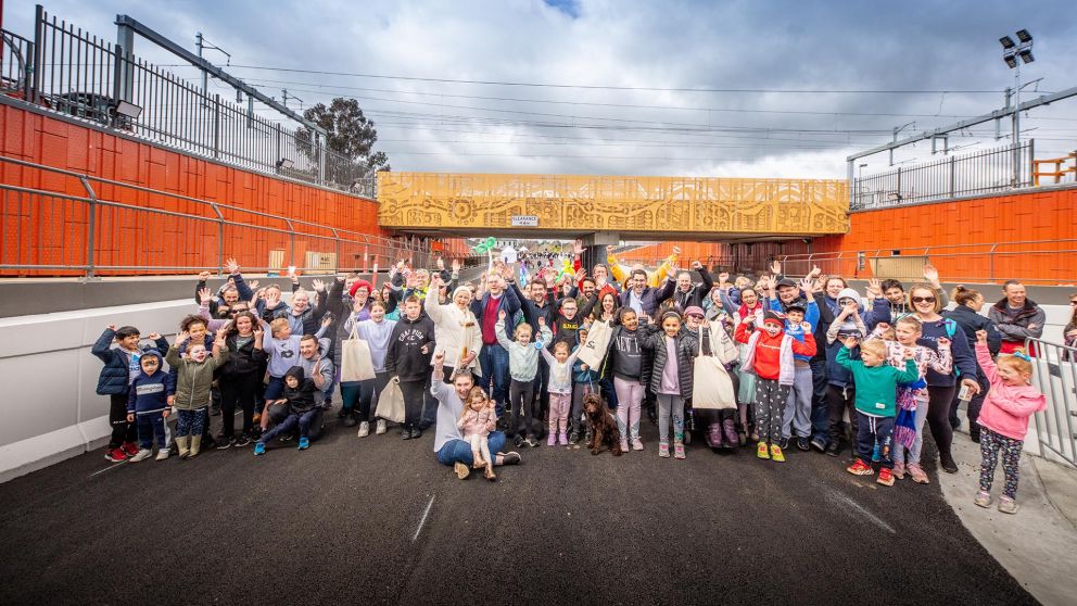 All smiles from the community as they celebrate their new bridge