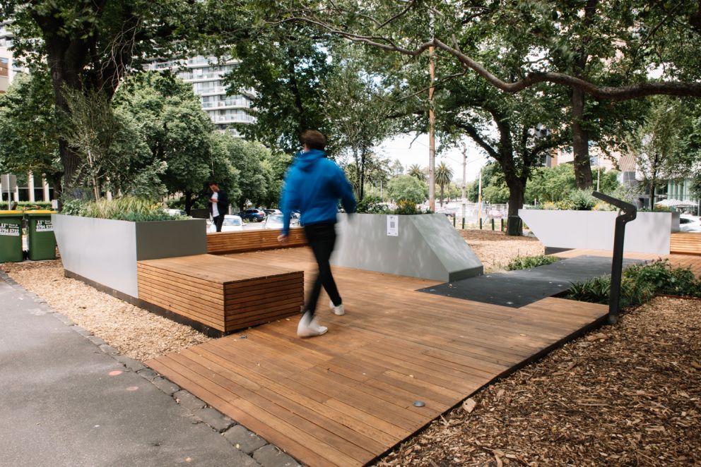 Pop-up park with wooden decking and planter boxes