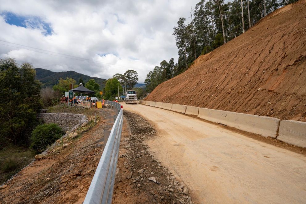 Truck carting material approaches front of the landslip from Falls Creek direction 31 March
