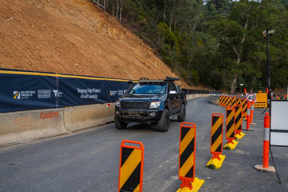 A vehicle drives through the single lane section of Bogong High Plains Road 24 April