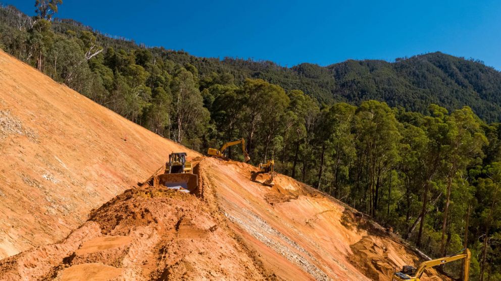 Machinery continues earth-moving works on the landslip 14 April