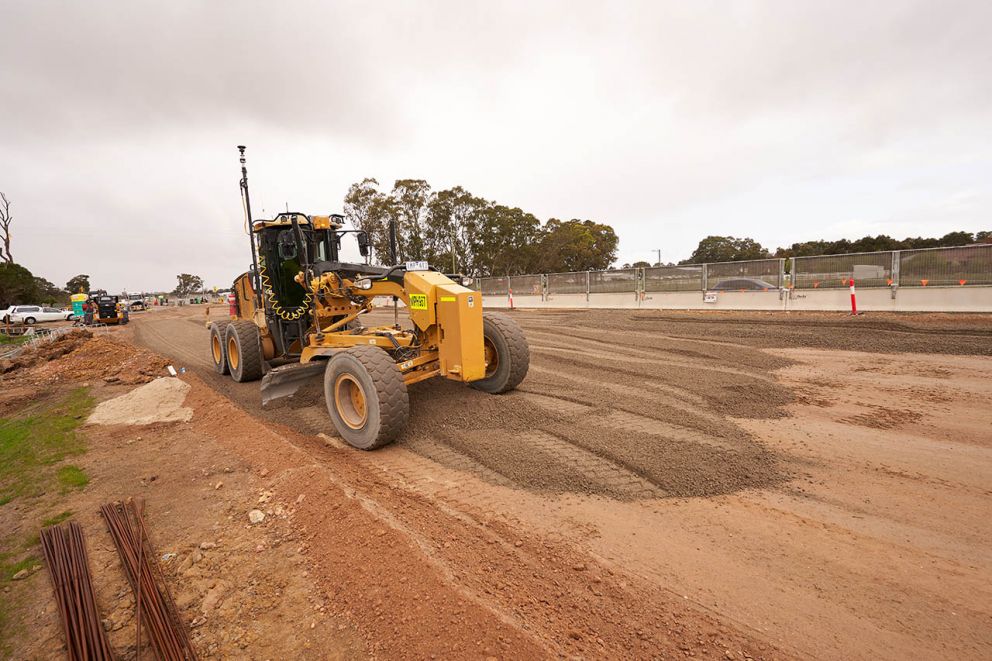 A grader using GPS assisted technology to precisely level the road