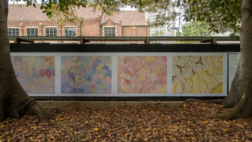 4 rectangular images featuring embroidered patterns on construction hoarding