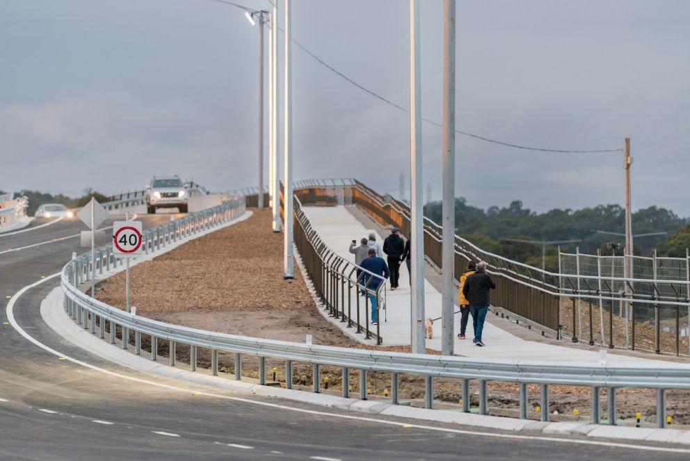The very first pedestrians over the new Brunt Road bridge travel via a shared use path