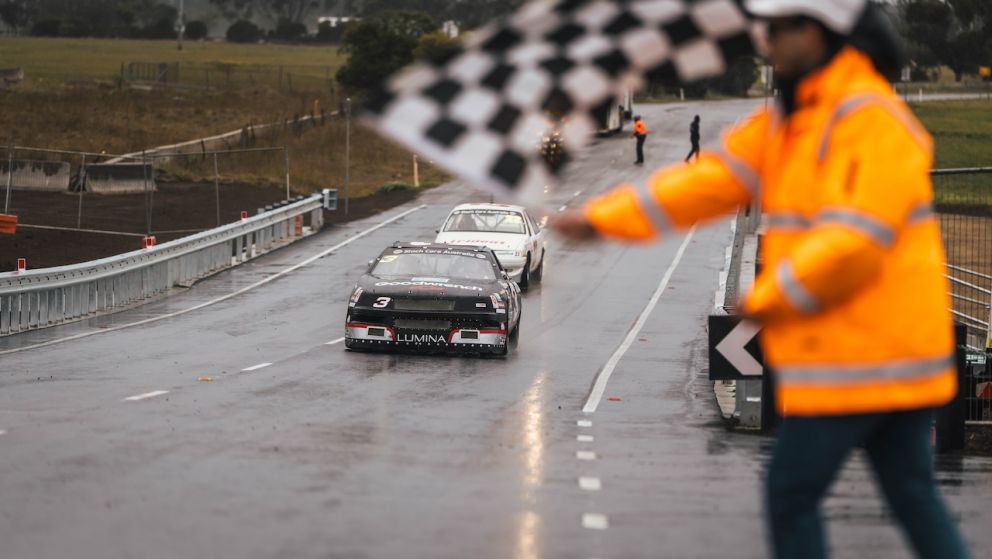Two race cars were among the first vehicles to test drive the new road bridge