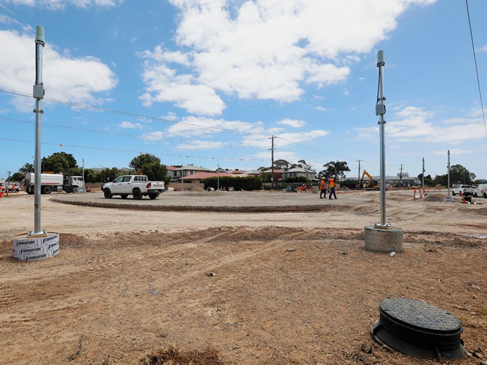 Installing the new traffic lights at its early stages, bare land