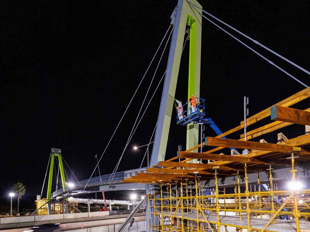 The Blaxland Avenue overpass being painted in the colour 'Kikuyu' which was chosen by the local community.