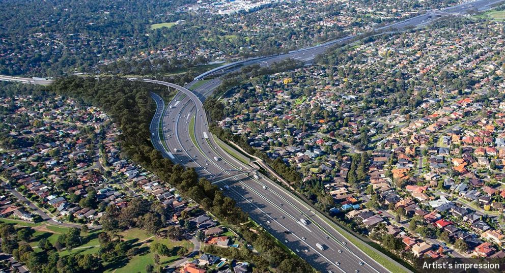 An artist impression birds eye view of the interchange at the Ring Road and Greensborough Road during the daytime.
