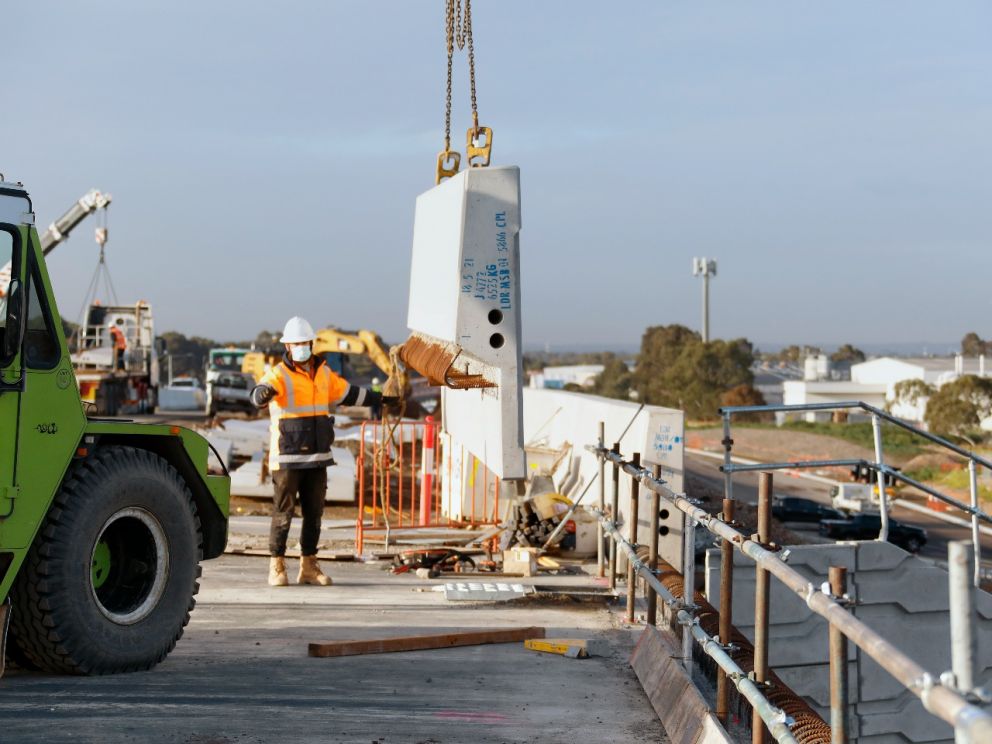 Installing barriers on the side of the Lower Dandenong Road bridge