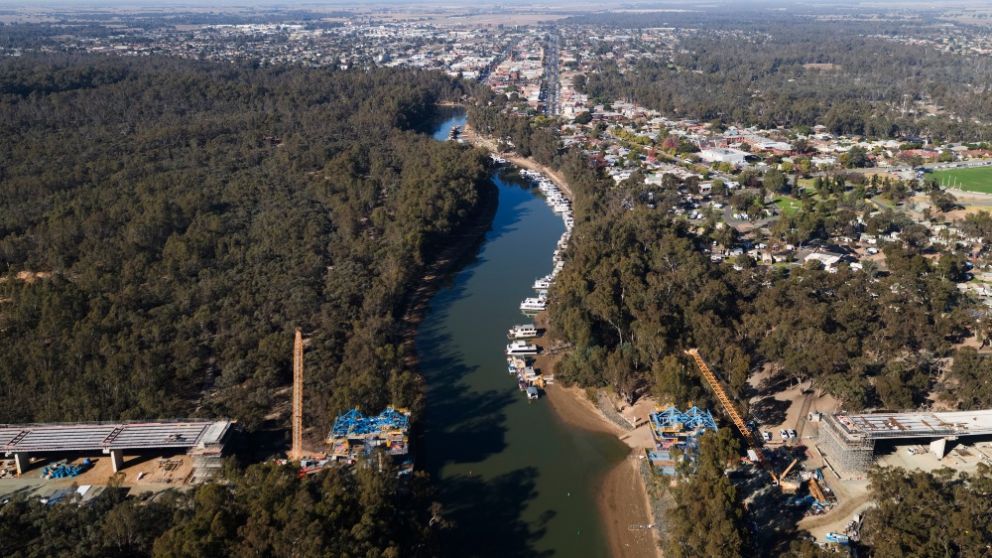 Form travellers ready to build the main bridge span over the Murray River (Echuca township top of image)