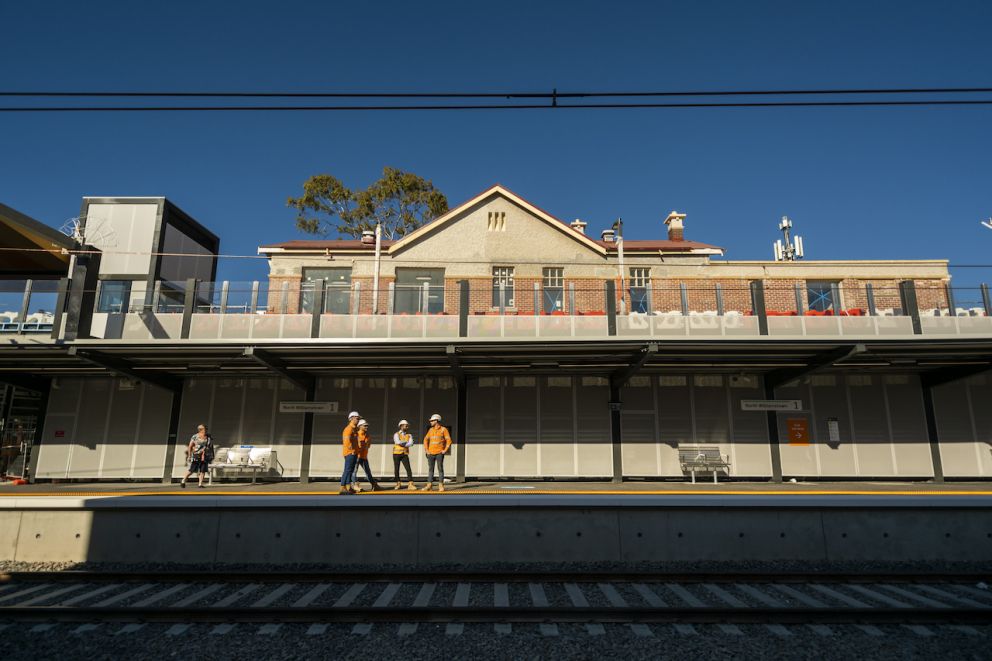 Project team members standing on the platform of the new North Williamstown Station.