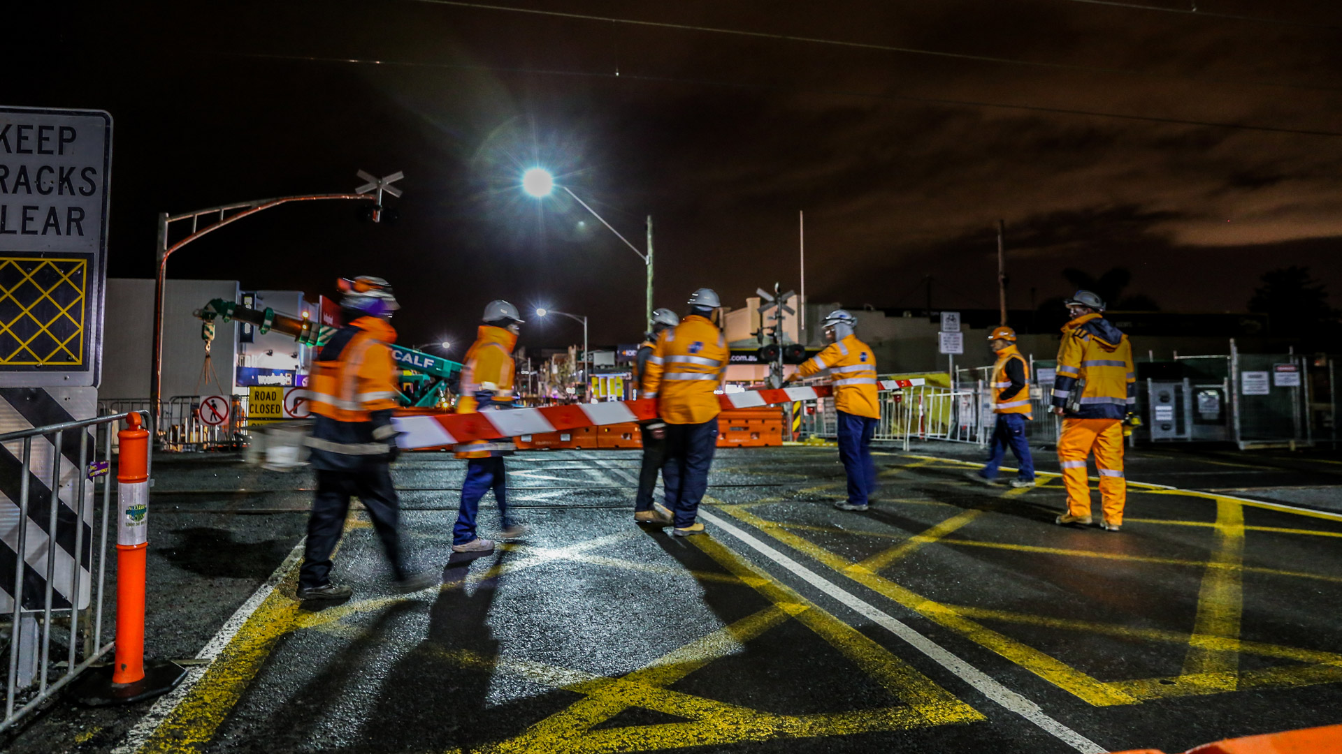 Workers removing the boom gate at Centre Road.