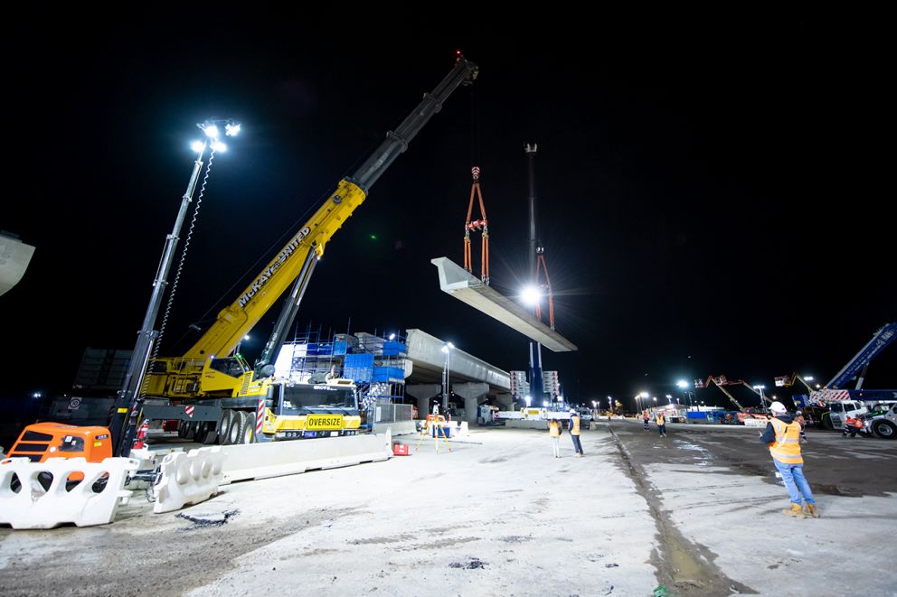 Two giant cranes lifted the L-beams into place